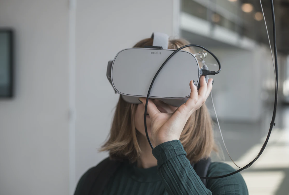 a woman wearing a VR headset for mental health in the metaverse
